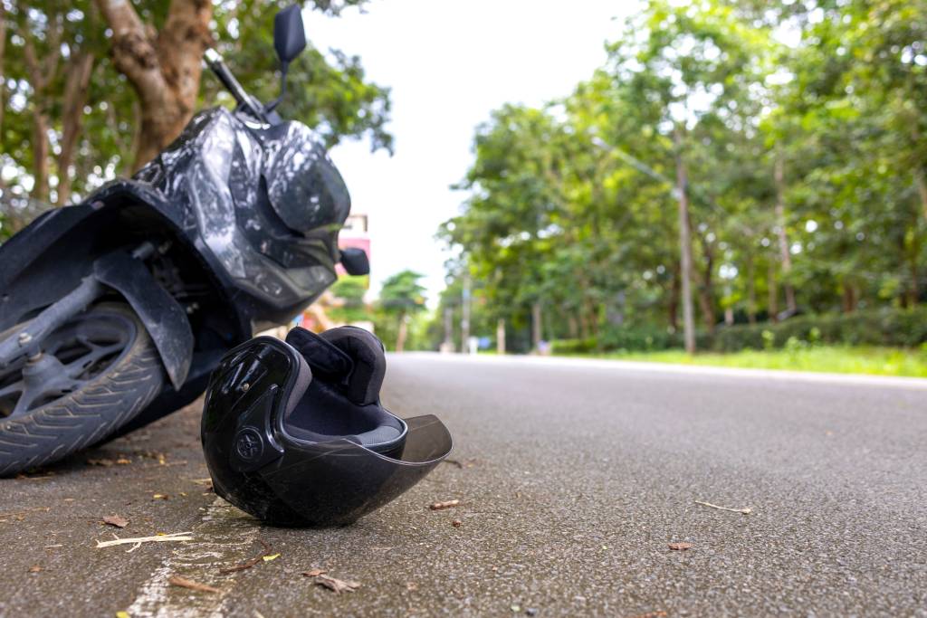 Motorcycle accident with helmet on road and safety reminder Save Life message, concept of road safety and awareness