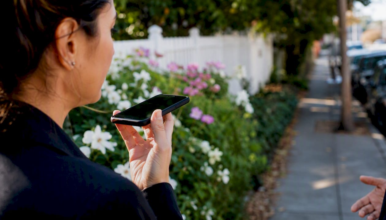 Phone recording witness statement outdoors