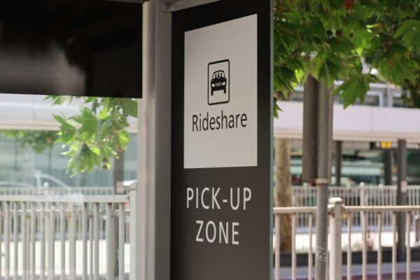 A sign alerting people to the pick-up zone for rideshare vehicles